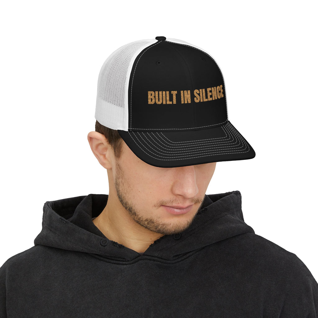 Built In Silence Snapback Trucker Cap — Bold Gold Embroidered Mesh Hat