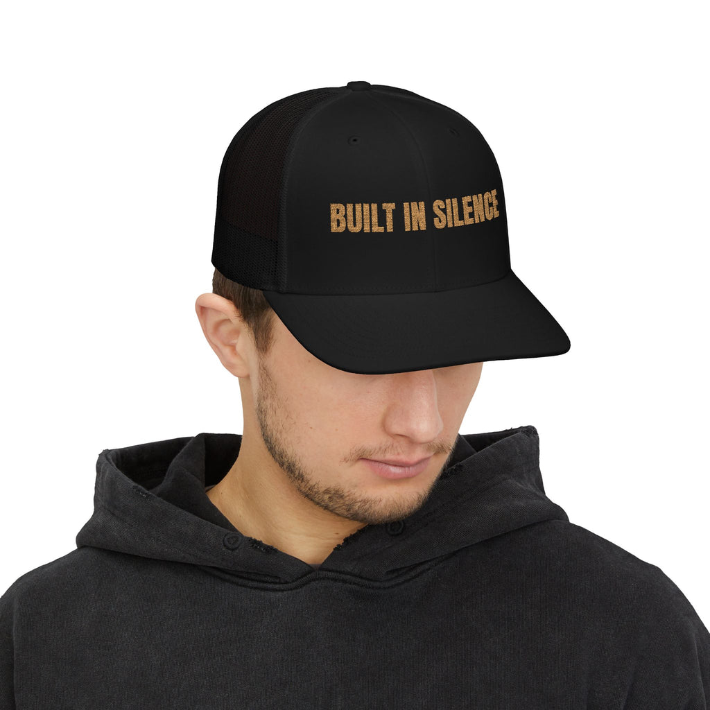 Built In Silence Snapback Trucker Cap — Bold Gold Embroidered Mesh Hat